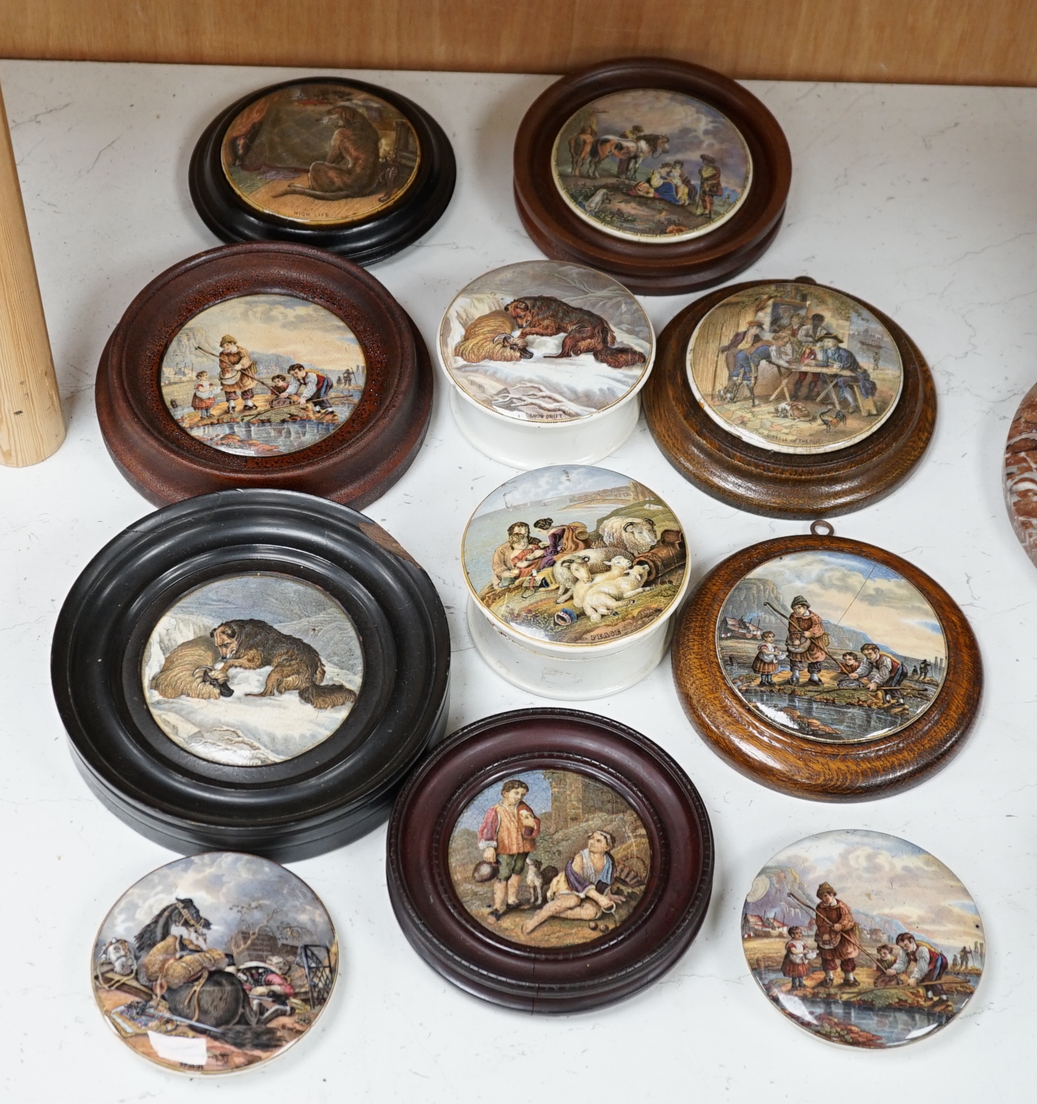 Eleven 19th century mostly framed pot lids including ‘The Snow Drift’, ‘War’, ‘High Life’, etc. Condition - mostly good, one cracked